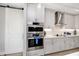 Modern kitchen with double oven and white cabinets at 300 150Th Ave # 502, Madeira Beach, FL 33708