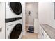 Stackable washer and dryer in a convenient laundry room at 300 150Th Ave # 502, Madeira Beach, FL 33708