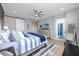 Spacious main bedroom with king bed, private balcony access, and ample natural light at 300 150Th Ave # 502, Madeira Beach, FL 33708