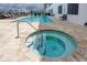 Community pool and spa area at 300 150Th Ave # 502, Madeira Beach, FL 33708