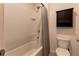 Bathroom with shower/tub combo and linen cabinet at 30755 Summer Sun Loop, Wesley Chapel, FL 33545