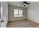 Spacious bedroom with ceiling fan and window at 30755 Summer Sun Loop, Wesley Chapel, FL 33545