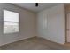 Well-lit bedroom featuring a closet and window blinds at 30755 Summer Sun Loop, Wesley Chapel, FL 33545