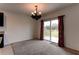 Dining area with sliding glass doors leading to backyard at 30755 Summer Sun Loop, Wesley Chapel, FL 33545