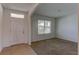 Bright foyer with tile flooring and entry to main living area at 30755 Summer Sun Loop, Wesley Chapel, FL 33545