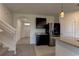 Modern kitchen with dark cabinets and granite countertops at 30755 Summer Sun Loop, Wesley Chapel, FL 33545