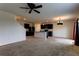 Open living room with kitchen and stairs access at 30755 Summer Sun Loop, Wesley Chapel, FL 33545