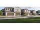 New townhome community with attached garages and manicured lawns at 32178 Jamaica Caper Way, San Antonio, FL 33576