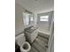 Renovated bathroom with new vanity, tub, and flooring at 3341 Wiltshire Dr, Holiday, FL 34691