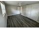 Bright bedroom with wood-look floors and double door closet at 3341 Wiltshire Dr, Holiday, FL 34691