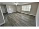 Bright living room featuring bay window and hardwood flooring at 3341 Wiltshire Dr, Holiday, FL 34691