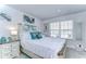 Bright bedroom featuring a queen-size bed and elegant decor at 35474 Quartz Lake Dr, Zephyrhills, FL 33541