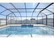 Relax in this beautiful screened pool and spa at 35474 Quartz Lake Dr, Zephyrhills, FL 33541