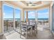 Dining area with beach views and natural light at 3702 El Centro St, St Pete Beach, FL 33706