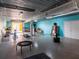 Garage featuring blue walls, white doors, exercise equipment, and a mannequin for boxing training at 3702 El Centro St, St Pete Beach, FL 33706