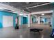 Large garage with blue walls, white doors, fitness equipment, and a boxing dummy at 3702 El Centro St, St Pete Beach, FL 33706