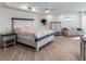 Beautiful main bedroom featuring bright white walls and furniture with a private sitting area at 3702 El Centro St, St Pete Beach, FL 33706