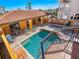 Luxury pool with a sunning deck, outdoor kitchen, and comfortable seating at 3702 El Centro St, St Pete Beach, FL 33706