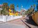 A paved walkway leads to a charming beachfront home at 3702 El Centro St, St Pete Beach, FL 33706