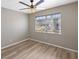 Bedroom with wood-look floors and a large window at 3717 Trophy Blvd, New Port Richey, FL 34655