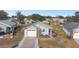 Aerial view of a single Gathering home with a gray roof and white garage door at 37401 Wedgewood Dr, Zephyrhills, FL 33542