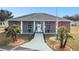 Community clubhouse with brick exterior and landscaping at 37401 Wedgewood Dr, Zephyrhills, FL 33542