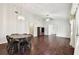 Dining room with dark wood floors and a round table at 37401 Wedgewood Dr, Zephyrhills, FL 33542