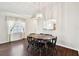 Dining area with hardwood floors and a round wooden table at 37401 Wedgewood Dr, Zephyrhills, FL 33542