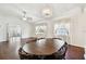 Dining area with hardwood floors and a round wooden table at 37401 Wedgewood Dr, Zephyrhills, FL 33542