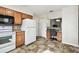 White appliances and wood cabinets in this kitchen at 37401 Wedgewood Dr, Zephyrhills, FL 33542