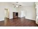 Living room with dark wood floors and built-in shelving at 37401 Wedgewood Dr, Zephyrhills, FL 33542