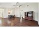 Living room features dark hardwood floors and a ceiling fan at 37401 Wedgewood Dr, Zephyrhills, FL 33542