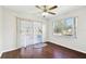 Living room with sliding doors to patio and wood floors at 37401 Wedgewood Dr, Zephyrhills, FL 33542