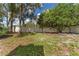 Large backyard with mature trees and a privacy fence at 3915 Briarlake Dr, Valrico, FL 33596