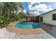 Inviting kidney-shaped pool with a large surrounding patio at 3915 Briarlake Dr, Valrico, FL 33596