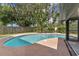 Relaxing kidney shaped pool with surrounding patio at 3915 Briarlake Dr, Valrico, FL 33596