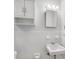 Simple bathroom with white tile and vanity at 4113 S Drexel Ave, Tampa, FL 33611