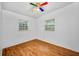 Bedroom with hardwood flooring and two windows at 4113 S Drexel Ave, Tampa, FL 33611