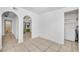 Dining area with archways leading to kitchen and bathroom at 4113 S Drexel Ave, Tampa, FL 33611