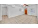 Bright living room with tile floors and wood door at 4113 S Drexel Ave, Tampa, FL 33611