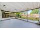 Large screened porch with view of the backyard at 4113 S Drexel Ave, Tampa, FL 33611