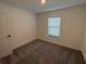 Well-lit bedroom featuring grey carpeting at 4294 Danbury St, North Port, FL 34286