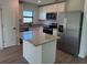 Modern kitchen featuring stainless steel appliances and granite countertops at 4294 Danbury St, North Port, FL 34286