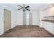 Bedroom with wood floors, a ceiling fan, and closet space at 435 Laughing Gull Ln, Palm Harbor, FL 34683