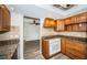 Cozy kitchen design featuring granite counters and views into the living area at 435 Laughing Gull Ln, Palm Harbor, FL 34683