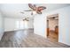 Spacious living room featuring stylish flooring, ceiling fans, and ample natural light at 435 Laughing Gull Ln, Palm Harbor, FL 34683