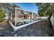 The screened-in pool is the centerpiece of the backyard, surrounded by lounge seating at 435 Laughing Gull Ln, Palm Harbor, FL 34683