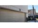 Attached garage door with house number and exterior light fixture at 440 Lakeview Dr # 33, Palm Harbor, FL 34683