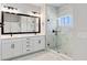 Elegant bathroom with white double vanity, marble shower, and modern fixtures at 441 42Nd Ne Ave, St Petersburg, FL 33703