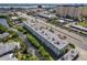 Aerial view showcasing a large building near water and a canal at 4455 Duhme Rd # 305, St Petersburg, FL 33708